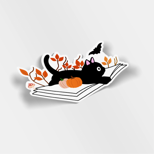 fall cat laying on book vinyl sticker